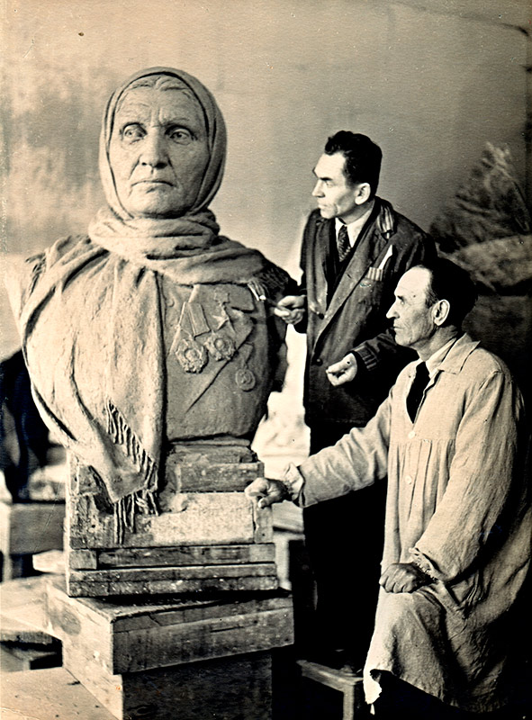 Sculptors D. Zhilov and A. Pekarev near the bust of Anna Koshevaya